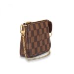 while its zipped compartment offers a surprising amount of space. It can be hand-carried or attached to a larger bag thanks to the gold-tone chain and hook.Detailed Features5.5 x 3.5 x 0.8 inches(Length x height x width)•Damier Ebene coated canvas•Cowhide-leather trim•Textile Lining•Gold-color hardware•Chain with hook•Zip closure•Chain: Not removable•Chain drop: 5.9 inchesMore Information