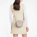 sans-serif; font-size: 16px; background-color: #ffffff;">For Summer 2020. Louis Vuitton introduces a miniature version of the soft-sided Boite Chapeau Souple PM handbag in Damier Azur canvas. Combining classic House details such as the gold-tone padlock and natural cowhide-leather trim with a side buckle and adjustable strap. this hatbox-shaped bag becomes irresistible.Detailed Features6.69 x 6.30 x 2.76 inches(Length x Height x Width)Damier Azur coated canvasNatural cowhide-leather trimMicrofiber liningGold-color hardwareLeather adjustable strap (drop: min. 42 cm/16.5 inches. max. 56 cm/22.1 inches)Curved side bucklesDouble zip closure with leather zip pullsPadlockInside flat card pocket