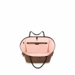 practical tote. The slim leather handles fit over the shoulder or on the arm. Shown here in Damier Ebene's canvas.