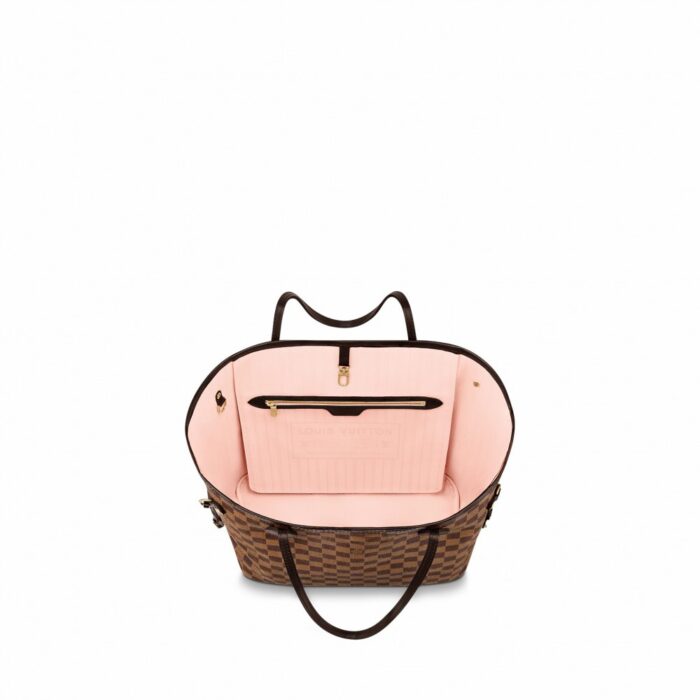 practical tote. The slim leather handles fit over the shoulder or on the arm. Shown here in Damier Ebene's canvas.