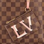 it is also fitted with a removable strap for shoulder or cross-body wear. This sleek