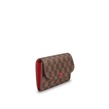 the Emilie Wallet is elegance itself in supple Damier Ebene canvas with a fresh lining color. Numerous pockets and an attractive shape make it irresistible.Detailed Features•7.7 x 3.9 x 0.6 inches•Coated Canvas•Grained Cowhide Leather lining and trimmings•Shiny golden color metal pieces•4 credit cards slots•1 zipped coin pocket•2 large inside flat pockets•1 large gusseted compartment•Press-stud closing•Made in France or Made in Spain