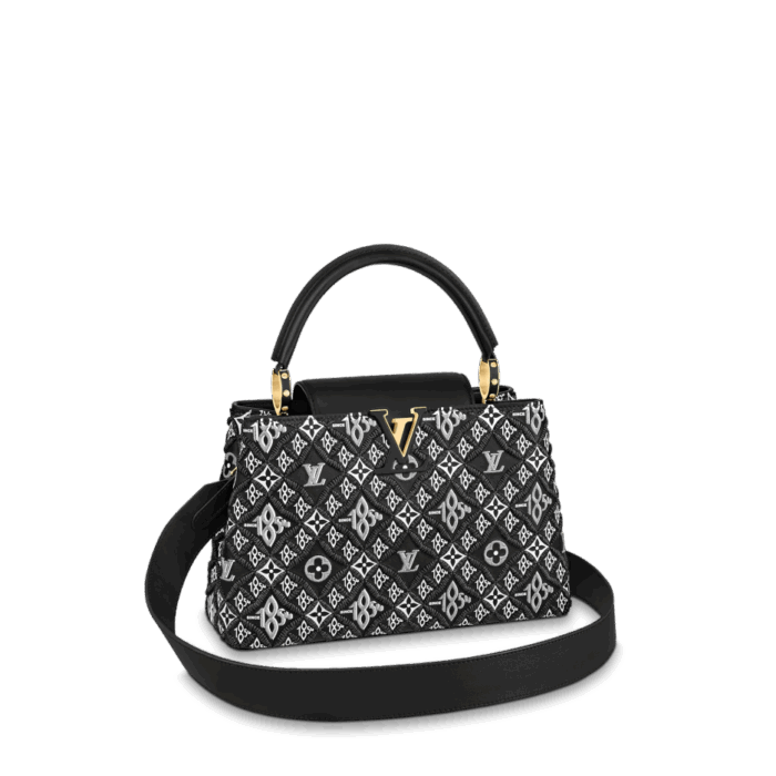 The Capucine MM is made of supple calf leather embroidered with Nicolas Ghesquière's newly designed "Since 1854" pattern. The pattern combines the traditional Monogram flower motif