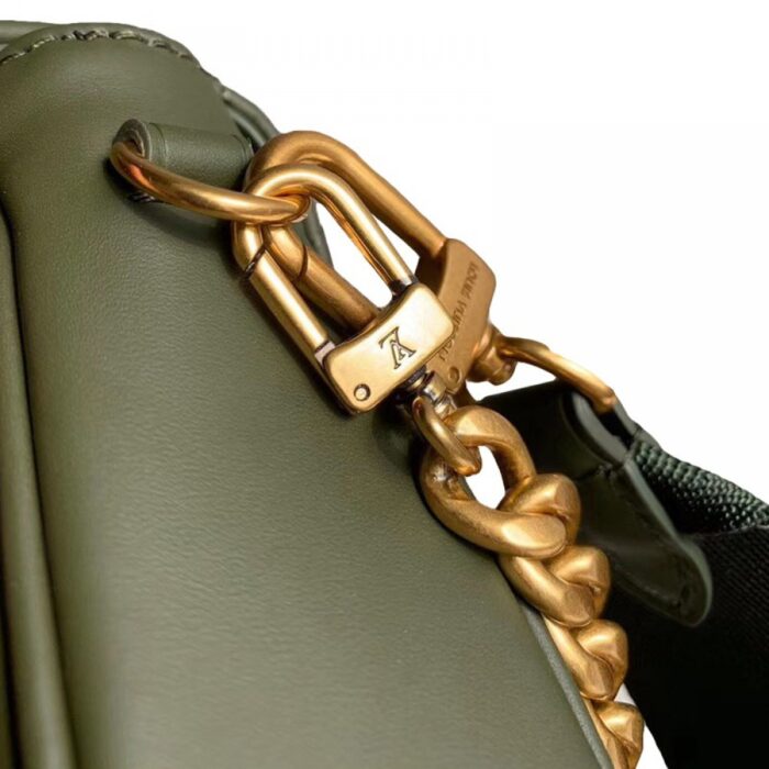 and round coin purse clipped on the strap’s snap hook