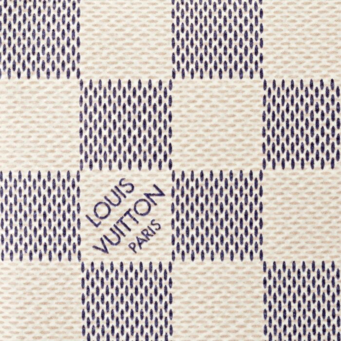 sans-serif; letter-spacing: 0.4px;">Crafted from supple Damier Azur canvas