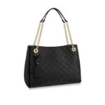 •L 14.6 x H 10.2 x W 5.9 inches•Black•Embossed and smooth cowhide•Smooth supple cowhide trim•Textile lining•Gold-color hardware•Chain handles with 2 smooth calf-leather shoulder pads•Zip closure•3 separate compartments: 1 central compartment with zipped closure and 2 side compartments with magnet closures•Double smartphone pocket inside•4 base feet•Smooth calf-leather name tag•4 eyelets with metal framing and D-ring