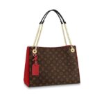 •36 x 2 x 13 CM•Cerise Red•Monogram coated canvas and grained calf leather•Smooth calf-leather trim•Microfiber lining•Gold-color hardware•2 chains straps with smooth calf leather shoulder pads•3 separate compartments: a central compartment with zipped closure and 2 side compartments with magnet closures•Double smartphone pocket•4 base feet•Smooth calf-leather name tag•4 eyelets with leather framing and D-ring