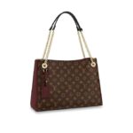 This Surene MM handbag in Monogram canvas and grained calf leather