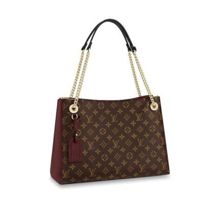 This Surene MM handbag in Monogram canvas and grained calf leather