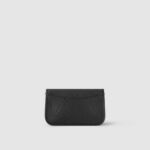 as well as a wide and removable jacquard cross-body strap with a woven "Louis Vuitton"