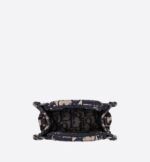 Maria Grazia Chiuri's phone bag is enriching the iconic Dior Book Tote line. A perfect example of the House's savoir-faire
