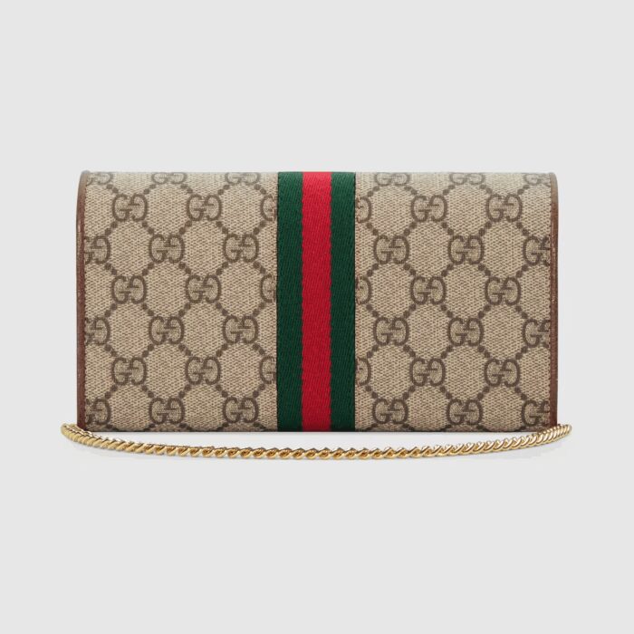 incorporating new shapes and silhouettes. The wallet has a compartmentalized construction and a removable chain strap that gives the structured shape dual functionality