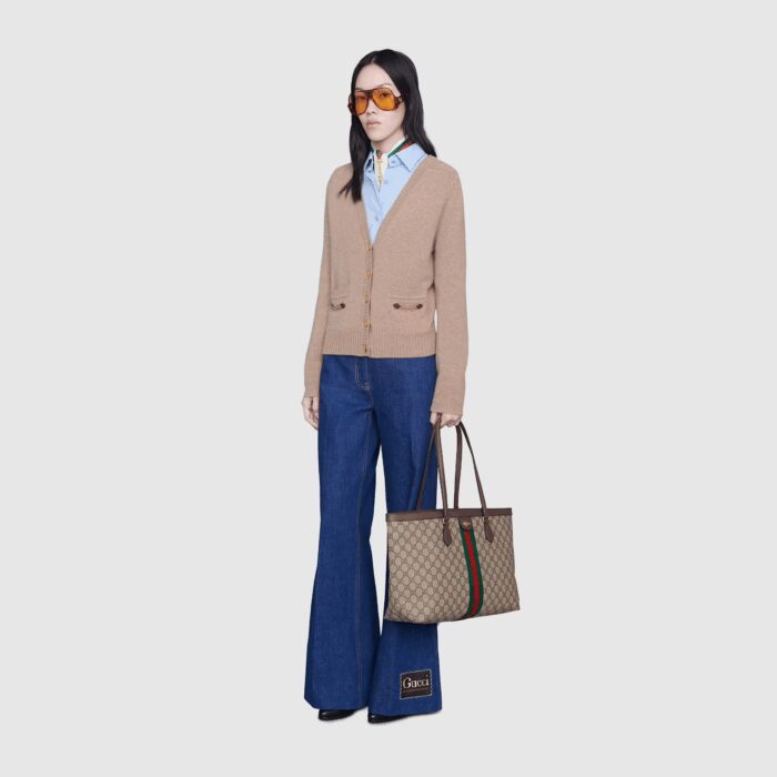 this new medium sized tote is trimmed with textured leather and topped with Double G hardware. Thanks to its long leather handles