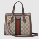 an archival Gucci code from the '70s that appears atop a leather tab detail and on the zipper pull.