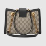 this structured shoulder bag features shoulder straps with a key-lock closure straight from the archive. Keys are stored in a removable leather key pouch.