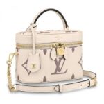 the Vanity PM handbag in Monogram Empreinte leather is a fashionably small bag with a distinctive shape. It is made from grained leather