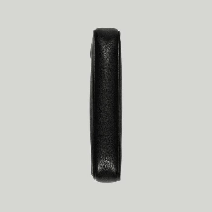 it's presented in a soft black leather with a gold-toned zip closure.