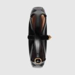 the recognizable shape is presented in black leather and enhanced with an additional