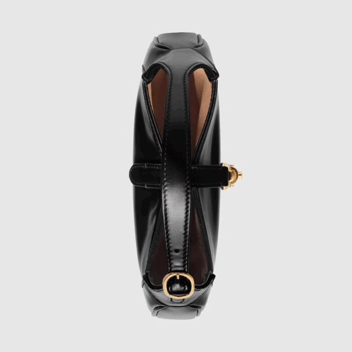 the recognizable shape is presented in black leather and enhanced with an additional