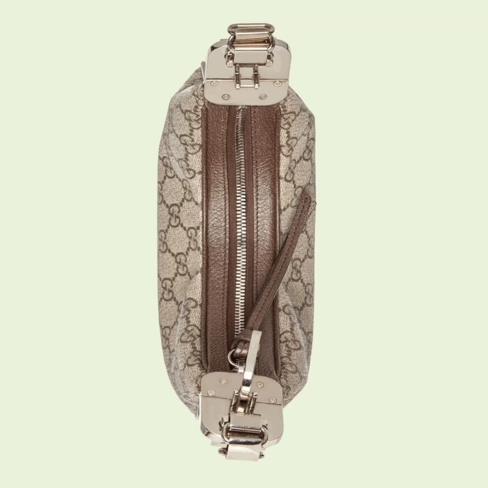 classic elements from the House's archives are reintroduced. Distinguished by its crescent moon shape