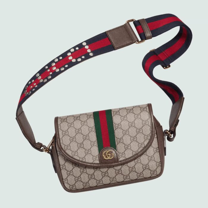 the mini-sized shoulder bag is crafted from the House's signature GG Supreme canvas in the traditional color combination of beige and ebony.