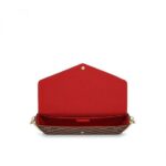 it can be transformed into a glamorous shoulder bag or clutch thanks to its removable golden chain.Detailed Features•8.4 x 4.5 x 1.2 inches•Damier Ebene Coated Canvas exterior•Coated Canvas & Cowhide Leather trim•Contrasted textile lining•Shiny gold colored metallic pieces•Inside flat pocket•Large compartment•2 removable parts: zip pocket & flat pocket with 8 credit card slots•Removable golden metallic chain for shoulder or cross-body carry•Press-stud closureMore Information