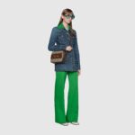 the double ring and bar design is a piece of the House's heritage. The Epilogue collection's Gucci Horsebit 1955 unifies this original details first introduced over six decades ago with a modern spirit in a small beige and ebony GG Supreme shoulder bag completed by a special mechanism that adjusts the length of the shoulder strap so it can be carried on one shoulder or cross body.