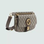 continues as part of Exquisite Gucci. The gold-toned buckle adds a refined vintage feel to this new belt bag style in beige and ebony GG Supreme