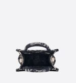 Maria Grazia Chiuri's phone bag is enriching the iconic Dior Book Tote line. A perfect example of the House's savoir-faire