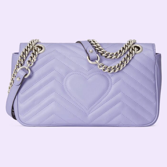 pastels continue to be explored throughout the latest collections. Made in matelassé chevron leather with a heart on the back in a light shade of lilac the now recognizable small GG Marmont chain shoulder bag has a softly structured shape and a flap closure with Double G hardware. Designed to be worn multiple ways