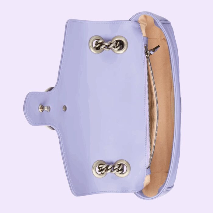 the chain strap slides to change between a shoulder and a top handle bag.
