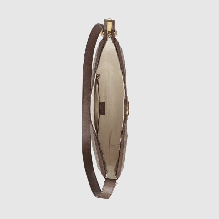 it's trimmed with textured leather and topped with Double G hardware.