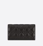 it features an antique gold-finish metal 'CD' signature flap that reveals a compartment to hold all the essentials. The removable 'CD'-link chain allows it to be worn over the shoulder