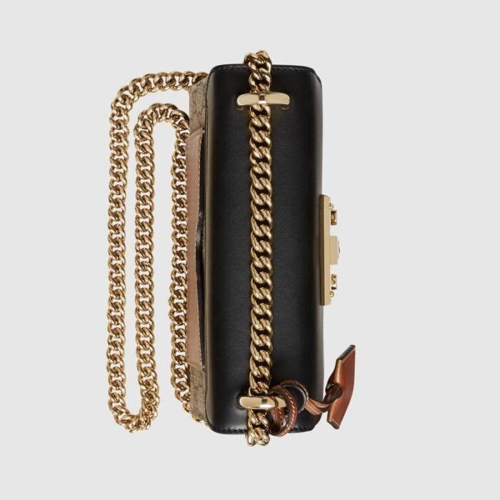 either on the shoulder or in the hand.