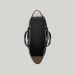 presented across a soft black leather base.