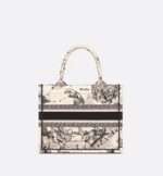 a variation of the iconic pattern that incorporate's Mr. Dior's passion for astrology. Adorned with the 'CHRISTIAN DIOR PARIS' signature on the front