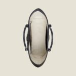 GG Supreme is introduced in a timeless mix of blue and beige for Gucci Love Parade. The canvas has come to the front of each collection decade after decade to become a hallmark of the House. Here