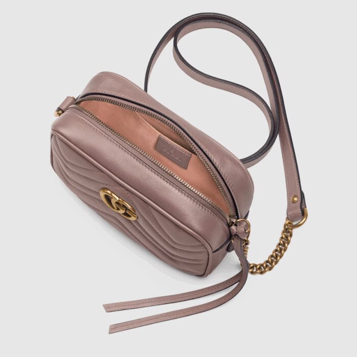 sans-serif; font-size: 12px; vertical-align: baseline; color: #4b4b4b; background-color: #ffffff;">The mini GG Marmont chain shoulder bag has a softly structured shape and a zip top closure with Double G hardware. The chain strap has a leather shoulder detail. The camera bag is made in matelassé leather with a chevron design and GG on the back.